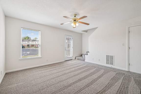 Spacious Living Area with Carpet