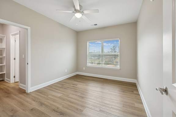 Bedroom with Wood-style flooring