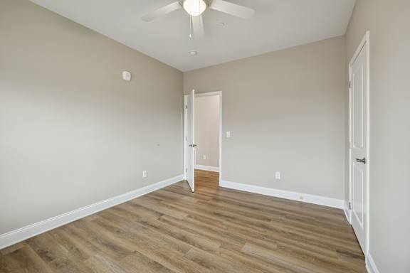 Bedroom with Wood-style flooring