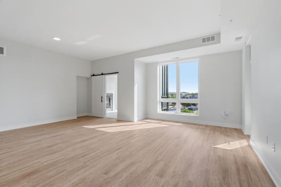 Spacious Living Area with Luxury Wood-Style Flooring