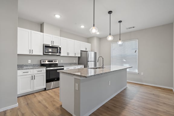 Fully-Equipped Kitchen with White Cabinetry