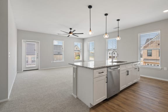 Expansive Kitchen Island with Overhead Lighting