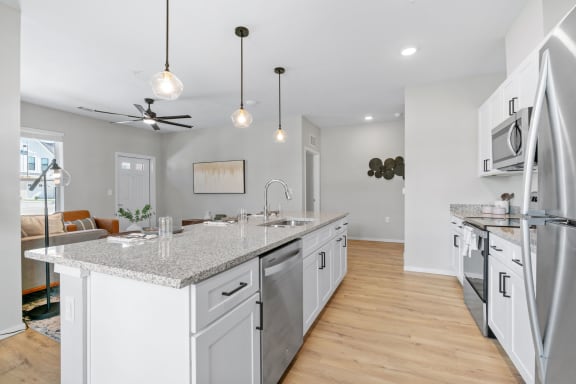 Kitchen with White Cabinetry and Stainless Steel Appliances
