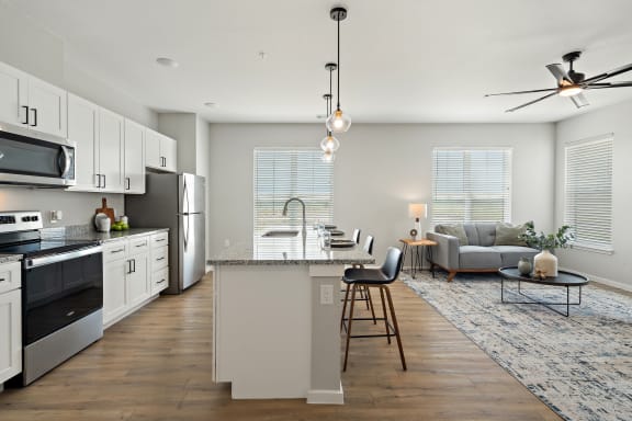 Expansive Kitchen Island with Overhead Lighting
