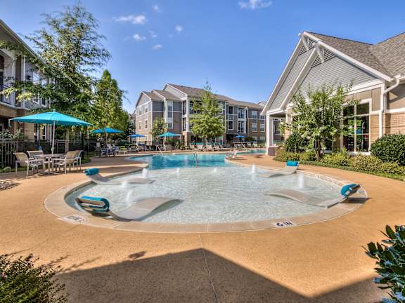 Apartment Homes Overlooking The Resort-Style Pool & Sundeck