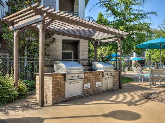 Outdoor Grill Area With Pergola