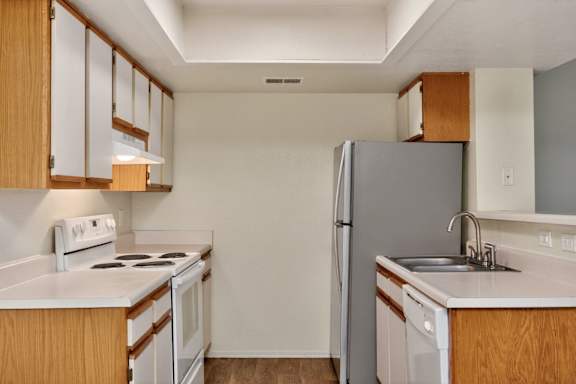 Kitchen with White and Stainless steel appliances