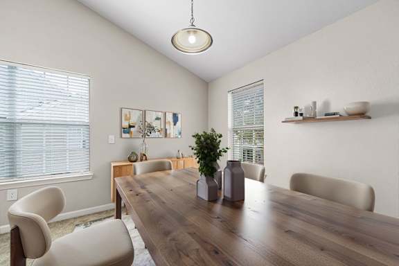 Dining area with high ceiling