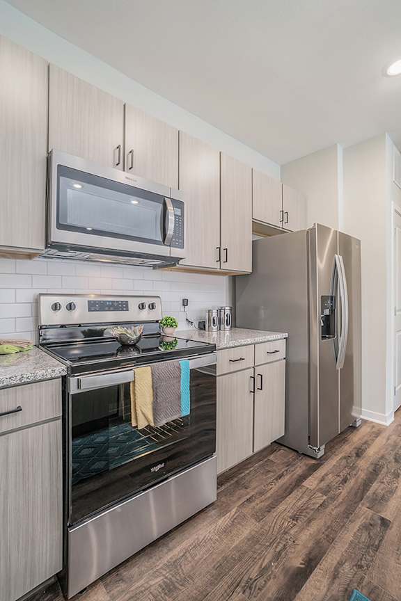 Premium Kitchen With Stainless Steel Appliances & Wood-Style Floors
