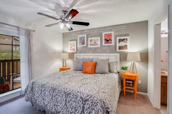 Bedroom with Large Window Overlooking Private Patio