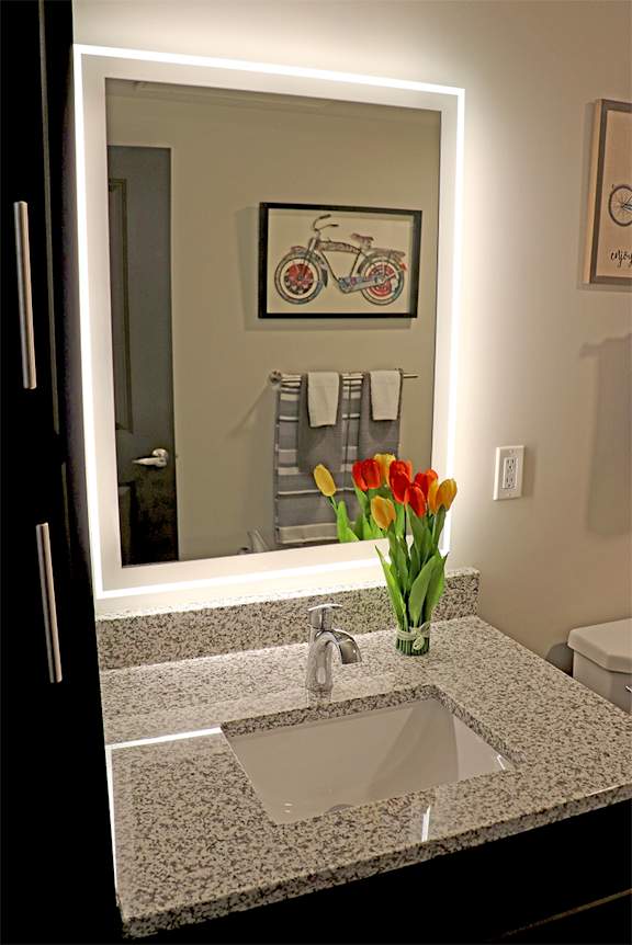 Back Lit Bathroom Mirror With Granite Vanity