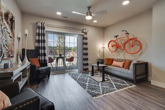 Living Room With Glass Sliding Patio Door & Wood-Style Flooring