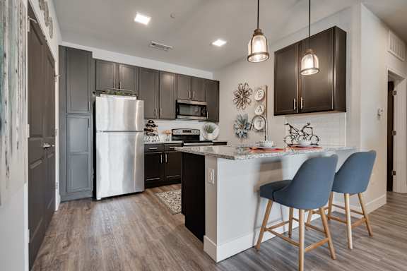 Kitchen With Granite Countertops & White Subway Tile Backsplash