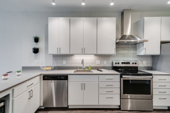 Kitchen with White Cabinetry and Stainless Steel Appliances