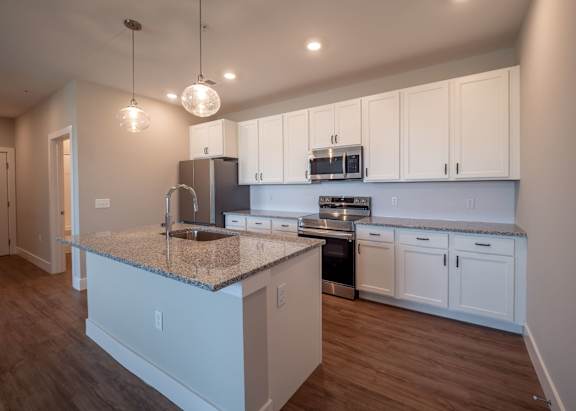 Fully Equipped Kitchen with white cabinets