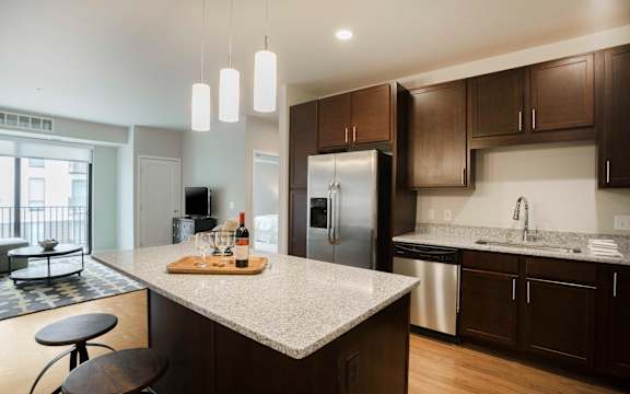 a kitchen with stainless steel appliances and granite counter tops