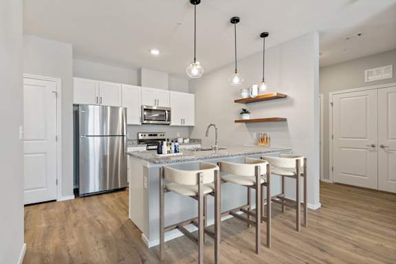 Kitchen with White Cabinetry and Stainless Steel Appliances