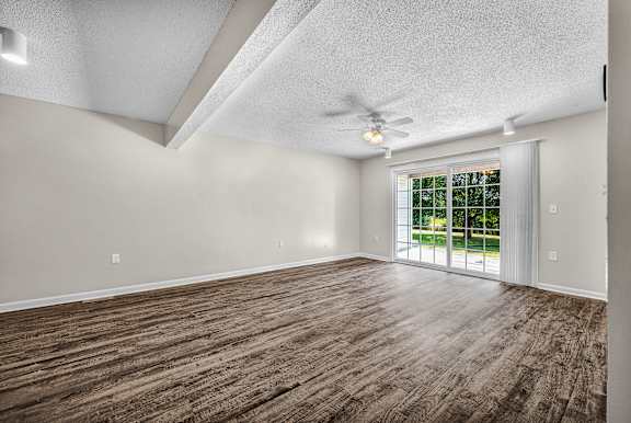 Spacious Living Area With Wood-Style Flooring