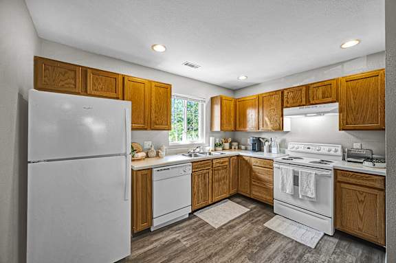 Fully Equipped Kitchen with White Appliances