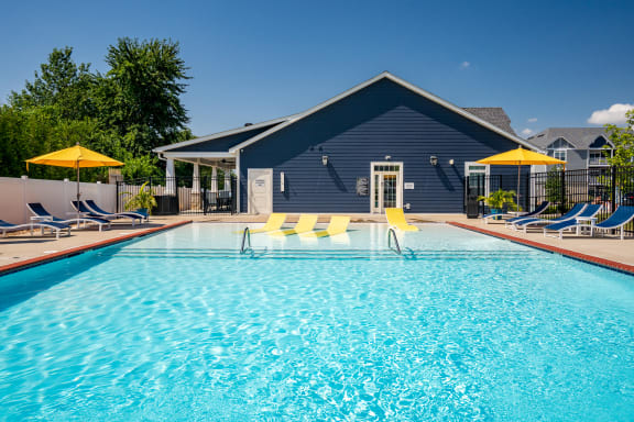 Outdoor Pool & Sundeck With Lounge Chairs & Umbrellas