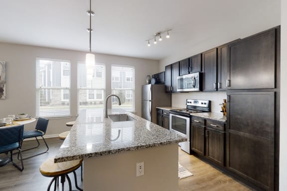 Spacious Kitchen with Large Granite Kitchen Island
