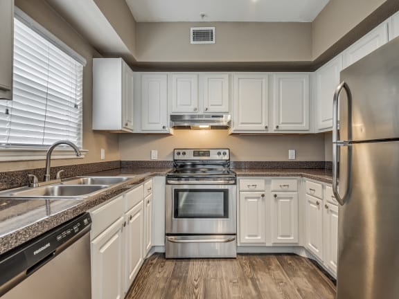 Kitchen with White Cabinetry and Stainless Steel Appliances