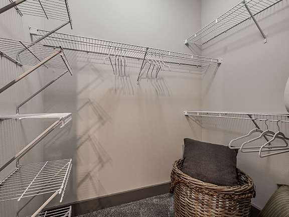 A room with a lot of clothes hangers.