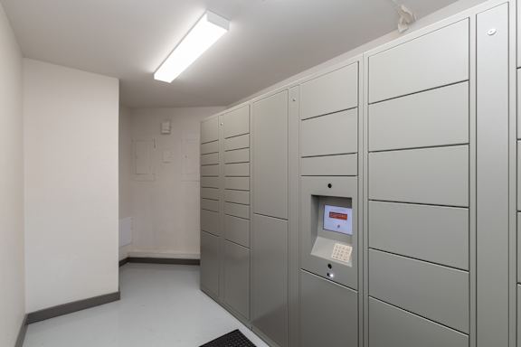 A row of metal lockers in a room.