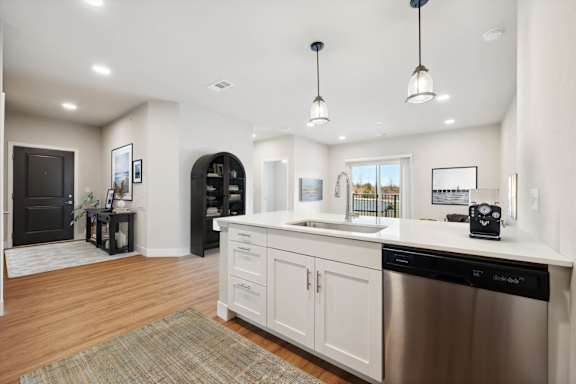 Kitchen with White Cabinetry and Stainless Steel Appliances