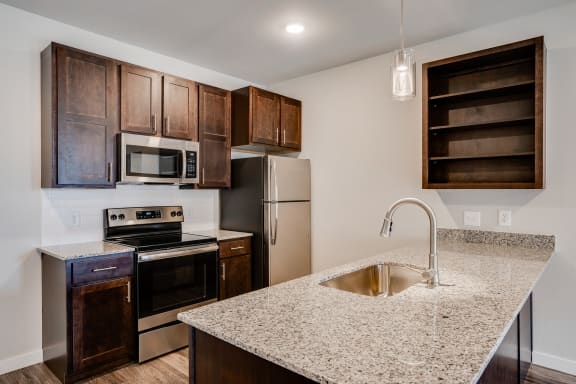 Fully-Equippped Kitchen With Granite Counters & Stainless Steel Appliances