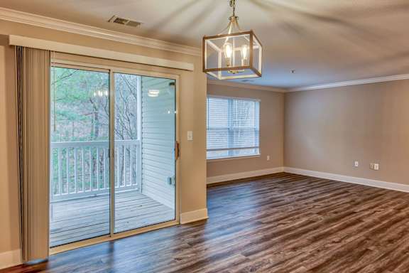 Spacious Living Area With Wood-Style Flooring