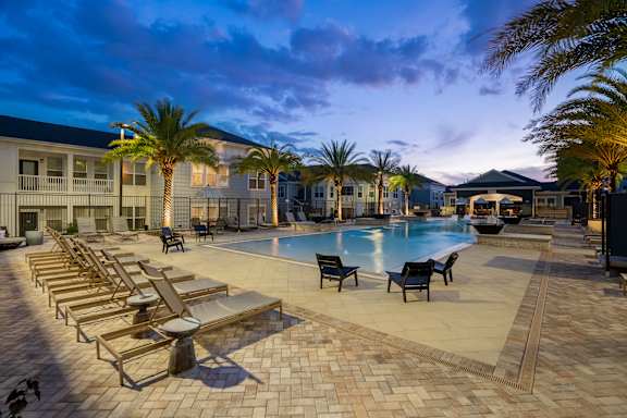 Beautiful Pool & Sundeck Glowing At Night