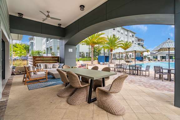 Covered Outdoor Pool Lounge With Large Table & Chairs