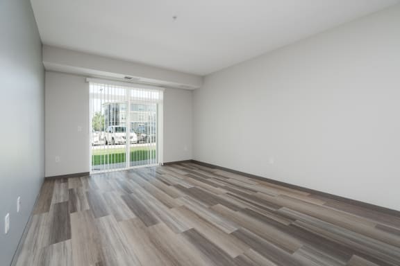 Living Room Area With Wood-Style Flooring In The Starling Floor Plan