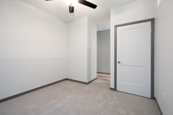 Studio Bedroom With Closet & Ceiling Fan With Light In The Lark Floor Plan