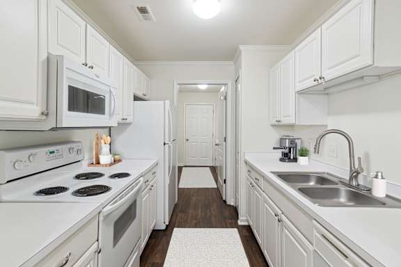 Fully Equipped Kitchen with White Appliances