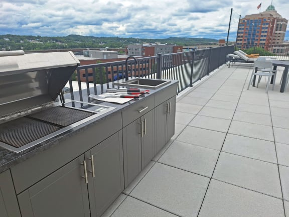 Relaxation is reimagined with a contemporary Roof Deck that includes a Grilling Station and Outdoor Kitchen, providing a stylish space to unwind.