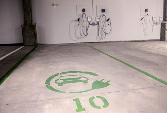 a car painted on the floor of a parking garage