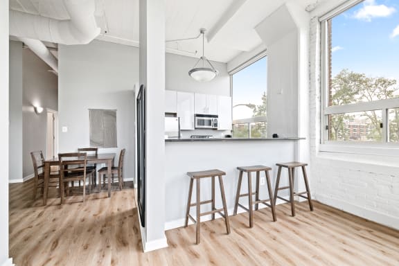 a kitchen and dining area in a 555 waverly unit