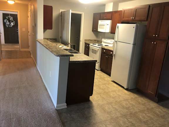 Kitchen with a refrigerator, microwave, and oven at Cooper Terrace in Elkin, NC 28621