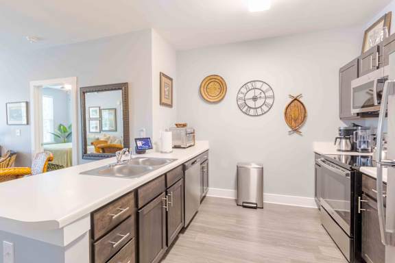 A kitchen with a white counter top and black cabinets. at Bulls Creek, Charleston, SC, 29414