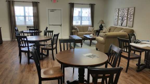 Wooden table with chairs in a room at Iron Bridge Rd Apts VA LLC, Chester, VA, 23831