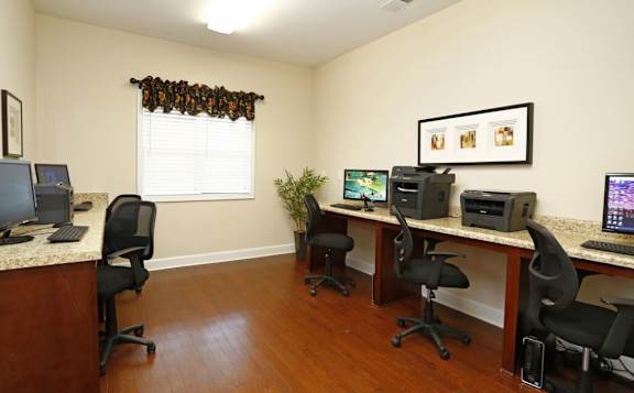 A room with a desk and chairs with a computer on it at Granite Falls Apartments, North Carolina, 27571