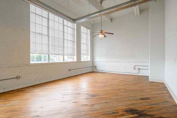 Room with wooden floors at Kemper Lofts Apartments, Lynchburg, Virginia