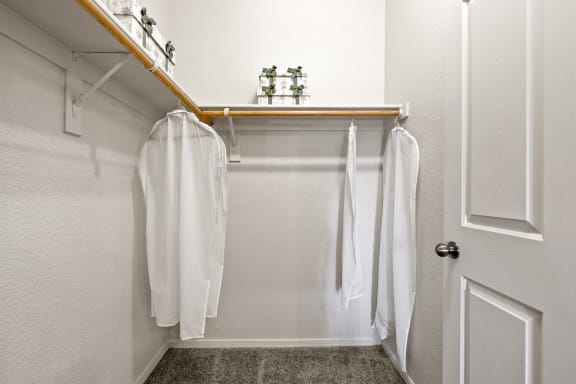 a bathroom with a white shower curtain and white towels
