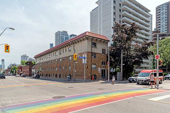 a family walking in the park with their children at 608 Church Apartments, Toronto, ON, M4Y 2E7
