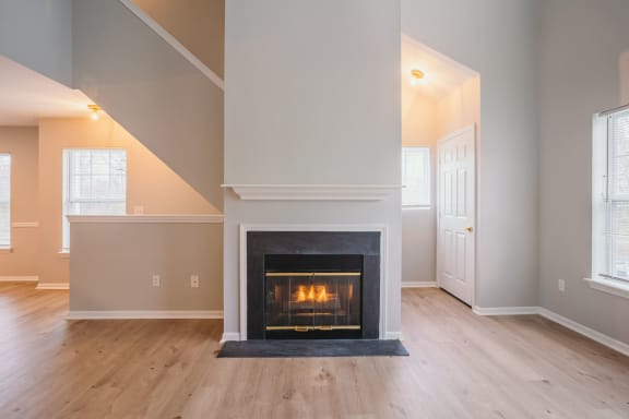 the living room of a house with a fireplace at Ardenwood Apartments, Connecticut, 06473