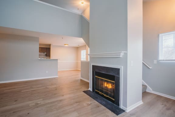 the living room has a fireplace and a hardwood floor at Ardenwood Apartments, North Haven, CT