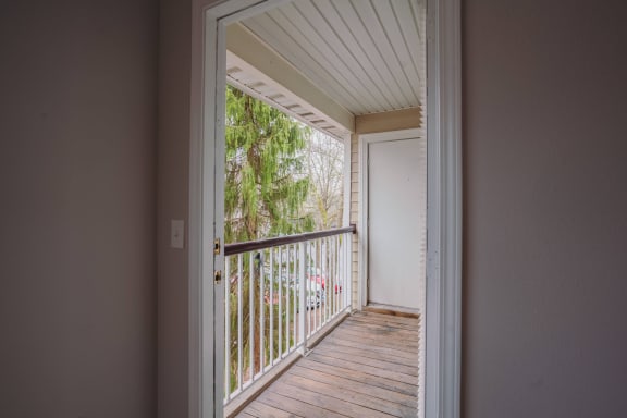 the view of a balcony from a room with a door open at Ardenwood Apartments, North Haven, CT, 06473
