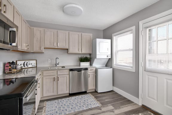 a kitchen with white appliances and wooden cabinets at Encore 99, Connecticut, 06512